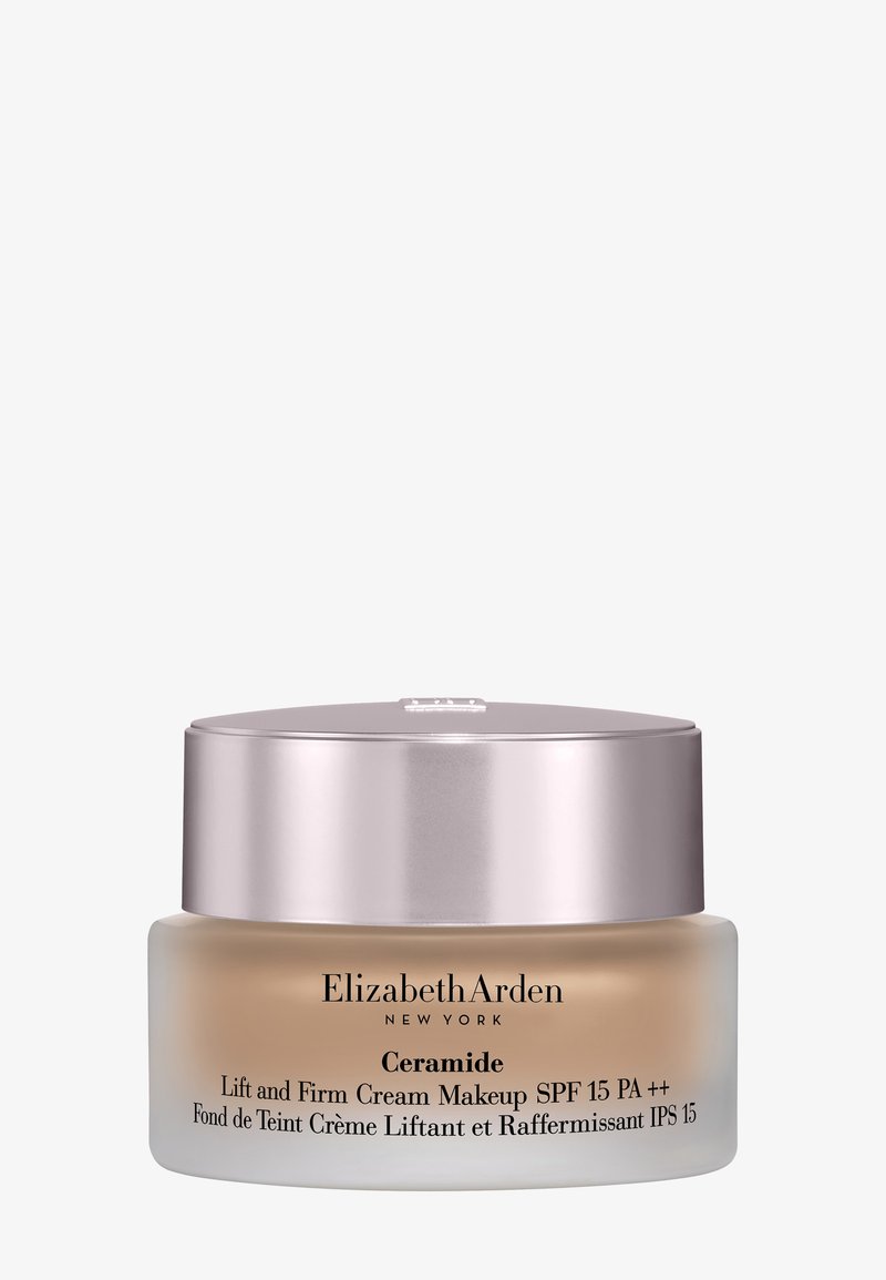 Elizabeth Arden Ceramide Lift and Firm cream makeup pot met SPF 15, beige tint, zilverkleurige dop, op witte achtergrond.