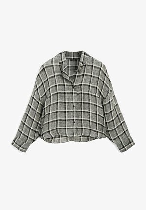 Camicia button-up accorciata in un motivo a quadri bianco e nero. Vestibilità rilassata, maniche lunghe e colletto. Realizzata in un tessuto morbido con una finitura testurizzata.