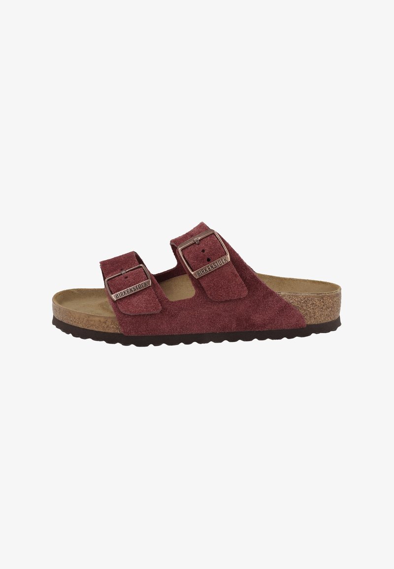 Maroon suede Birkenstock sandal with two adjustable buckle straps, cork footbed, and textured black sole, side view.