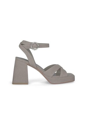 Gray suede high-heeled sandals with a block heel, cross-strap design, adjustable ankle strap, and a circular rhinestone accent.