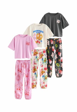 Set of five coordinated pajamas featuring cotton t-shirts and elastic waist pants in bright colors with playful food-themed prints and patterns.