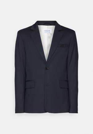 Blazer marine en tissu texturé, doté d'une fermeture à un bouton, de deux poches avant et d'un col à revers.