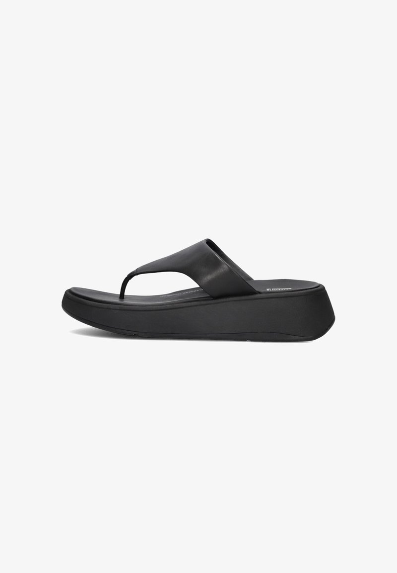 Zwarte flip-flopsandalen met een brede band, een gevormde voetbed en een dikke zool. Gemaakt van leer met een gladde textuur en een minimalistisch ontwerp.