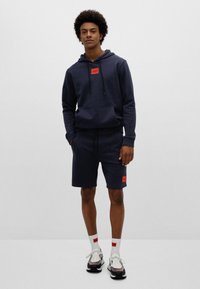 HUGO DIZ - Tracksuit bottoms - dark blue