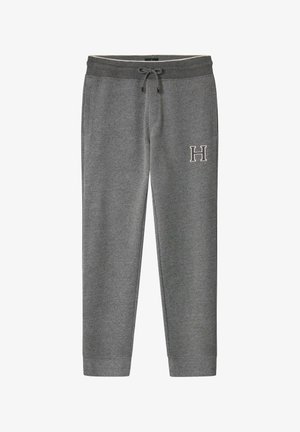 Graue Jogginghose aus weichem Material, mit einem Kordelzugbund und Seitentaschen. "H" auf dem linken Oberschenkel gestickt. Schmal zulaufendes Beindesign.