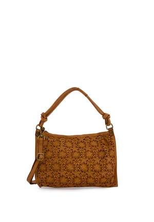 Brown leather handbag with floral cutout design, knotted handles, and adjustable shoulder strap on a white background.