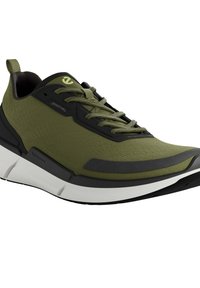 Green athletic shoes featuring a textured upper, black accents, a cushioned white midsole, and a rear pull tab for easy wear.