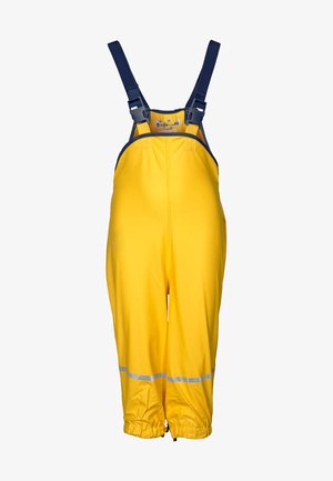 Gele waterproof overall met verstelbare marineblauwe schouderbanden, elastische manchetten en reflecterende accenten aan de taille en knieën. Duurzaam, gladde textuur.