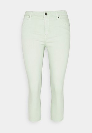 Off-white slim-fit cropped jeans met knoopsluiting aan de voorkant, ritssluiting en ontwerp met vijf zakken op een effen achtergrond.