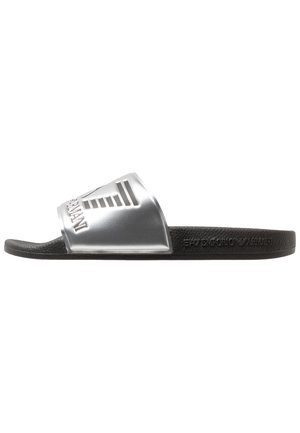 Black slip-on sandal with a textured sole and a silver strap featuring the Emporio Armani logo and brand name.