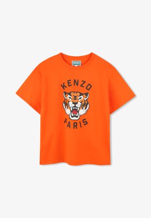 T-shirt en coton orange avec un graphique de tigre noir et le texte "KENZO PARIS" en lettres majuscules sous le design. Manches courtes, col rond.