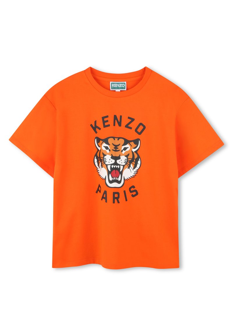 T-shirt en coton orange avec un graphique de tigre noir et le texte "KENZO PARIS" en lettres majuscules sous le design. Manches courtes, col rond.