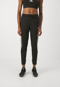 adidas Sportswear - FUTURE ICONS THREE STRIPES REGULAR PANT - Trainingsbroek - black Miniatuurafbeelding 1