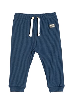 Pantalones de chándal de ribete en color marino con cintura elástica, cordón blanco y parche con logo. Puños en los tobillos para un estilo ajustado. Textura suave.