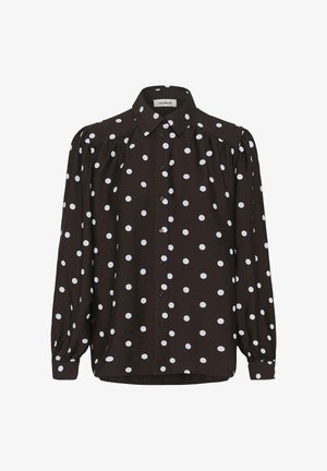 Bruine blouse met lange mouwen en witte stippen, knoopsluiting aan de voorkant, puntige kraag en licht opgeblazen mouwen. Zachte, gestructureerde stof.