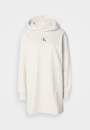 Sweatshirt à capuche en mélange de coton beige clair, avec des manches longues et un petit logo foncé sur la poitrine. Coupe décontractée avec une texture douce.