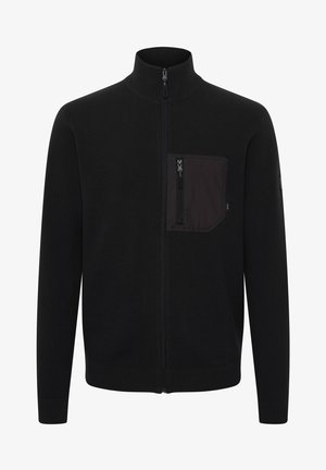 Black zip-up sweater with a high collar, ribbed cuffs and hem, featuring a black fabric chest pocket with a zip closure. Smooth texture.