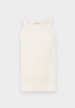 Cream ribbed tank top with thin straps, fitted design, and a straight hem. Label reads "IVY OAK." Material appears soft and stretchy.