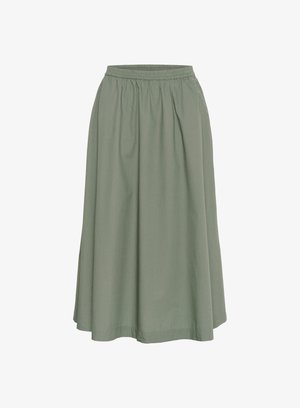 Roheline, põlvini ulatuv seelik, mis on valmistatud kerge kangaga, kogutud vöökoha ja voogava kujuga. Ilma nähtavate mustrite või kaunistusteta.