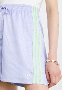 adidas Originals FASHION MONOGRAM - Tracksuit bottoms - violet tone