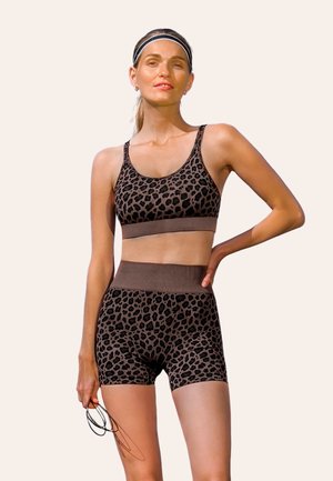Brown leopard print sports bra and shorts set, featuring a snug fit, soft texture, and contrasting solid color waistband.