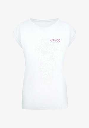 Bela kratka majica s kratkimi rokavi in zaobljenim ovratnikom ter zavitimi manšetami. Na prednjem delu so tri majhne roza srčne oblike.