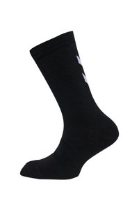 Chaussette noire en tissu texturé, avec un design uni et un bord côtelé. Elle présente un détail de logo blanc à l'avant.