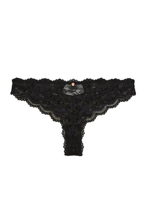 String noir en dentelle avec motifs floraux et bords festonnés, orné d'un petit pendentif rond en or au centre avant.