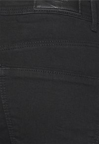 Vero Moda Tall VMTANYA PIPING - Calças de ganga de corte skinny - black