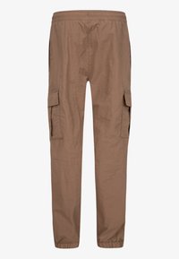 Brown cargo pants with elastic waistband, side pockets with flaps, and elastic cuffs at the ankles on a plain background.