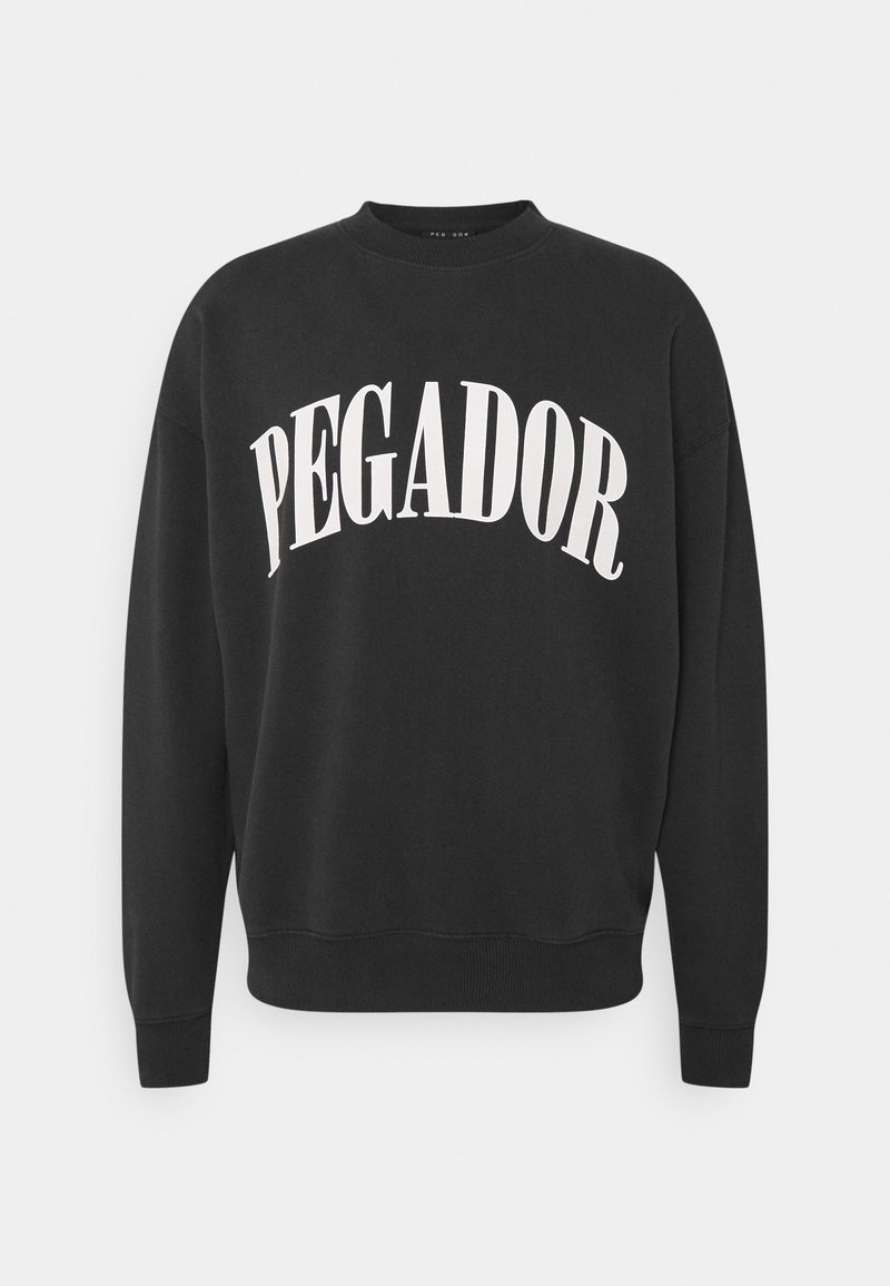 Felpa nera realizzata in morbido tessuto, con la scritta bianca "PEGADOR" in un design arcuato. Polsini e orlo a coste, scollo rotondo.