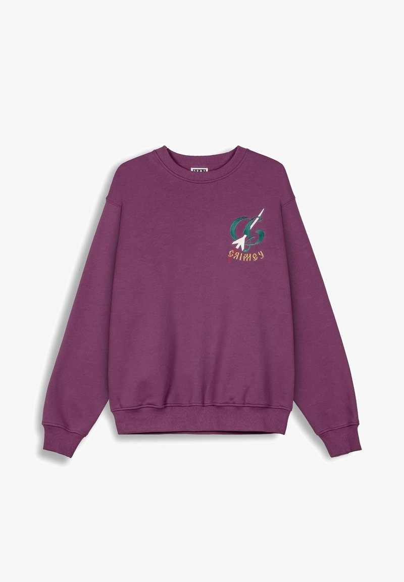Sudadera morada de algodón con cuello redondo y puños de canalé. Presenta un diseño gráfico en la parte superior izquierda del pecho con acentos multicolores.