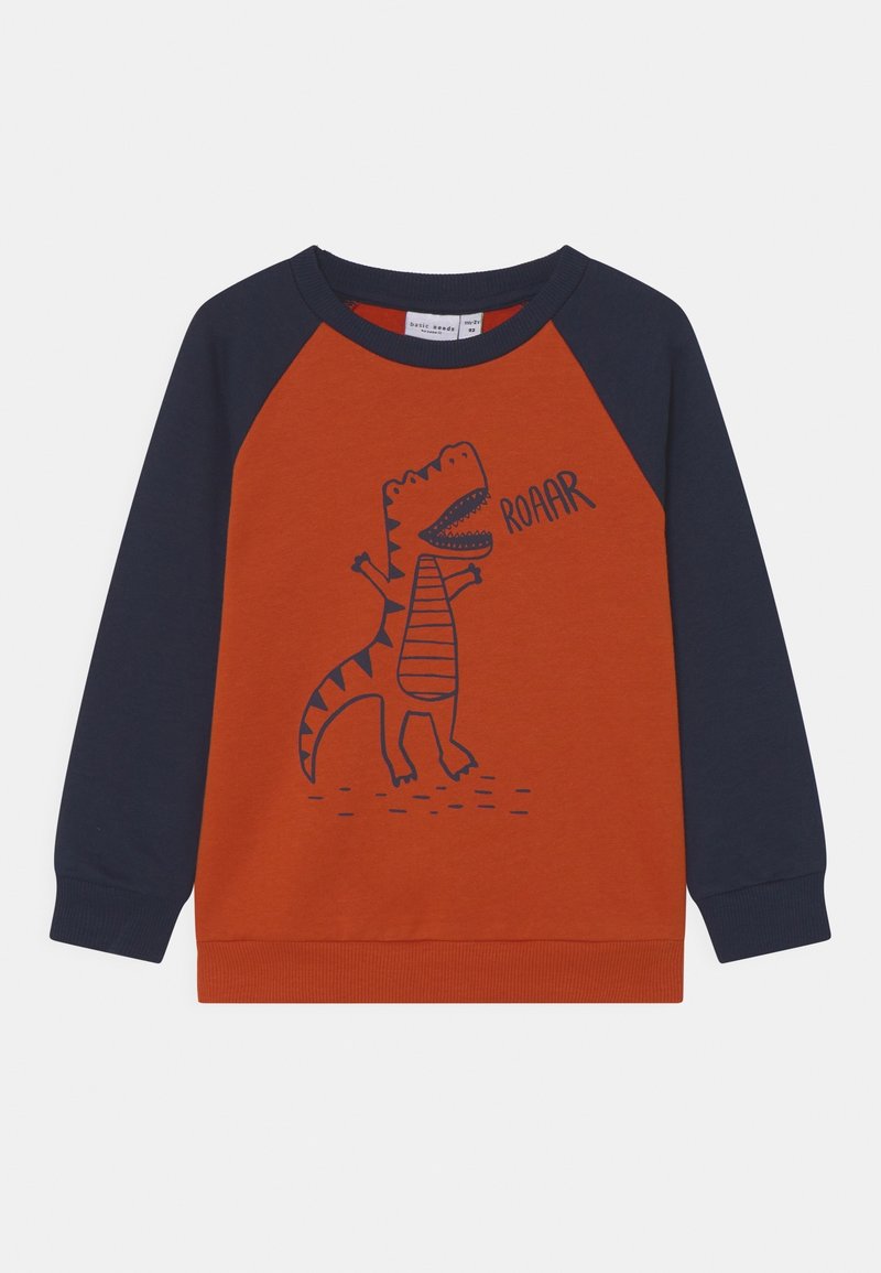 Sweatshirt orange avec manches raglan marine. Comprend un graphique de dinosaure et le texte "ROAAR" en bleu. Matière douce, bords côtelés aux poignets et à l'ourlet.