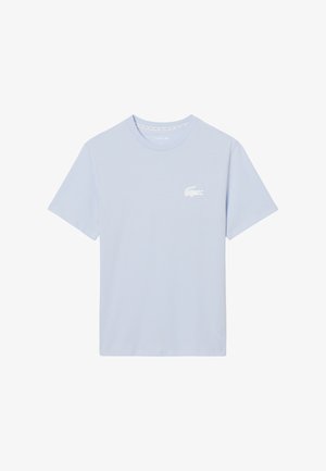 Maglietta celeste in cotone, con scollo rotondo e maniche corte. Piccolo logo coccodrillo ricamato bianco sul petto.