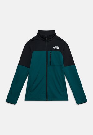 Veste zippée intégrale pour homme avec col montant, noir sur le haut et bleu sarcelle foncé en bas, avec poches zippées à l’avant et sur la poitrine et logo The North Face.