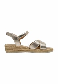 Sandale en or métallisé avec design à brides croisées, semelle compensée en espadrille tressée et bride de cheville réglable. Texture lisse et bout ouvert.