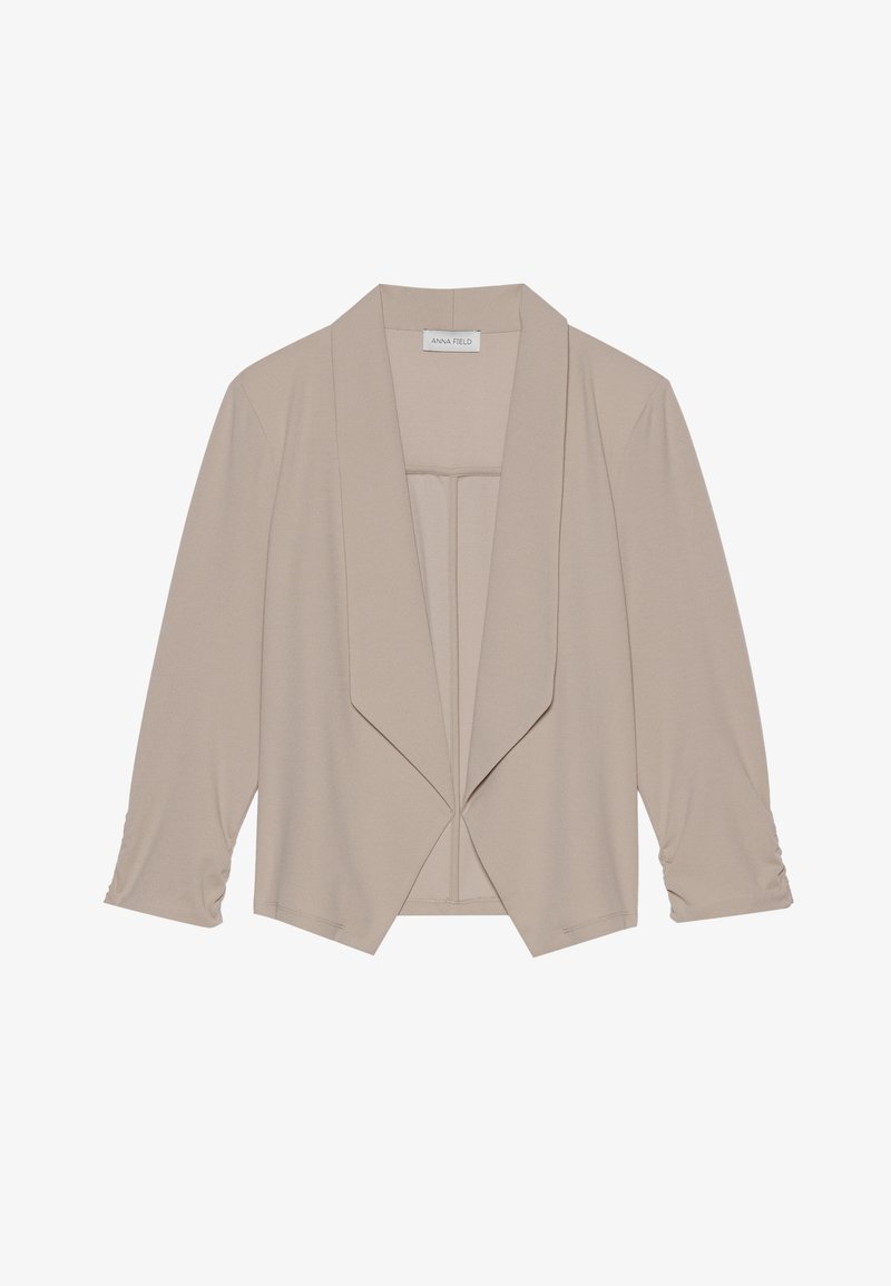 Bež jakna iz lahkega materiala z drapiranim sprednjim delom, rokavi do tri četrtine in nabranimi manšetami. Mehka tkanina z gladko teksturo in brez zapenjal.