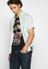 Levi's® 502™ TAPER HI-BALL - Calças de ganga de perna direita - med indigo