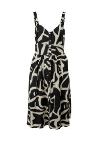 Robe à motifs noirs et crème avec bretelles réglables, devant boutonné et taille froncée, présentant des formes abstraites et des détails en pointillés.