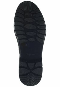 Schwarze Gummisohle mit strukturierter Oberfläche, die ein Muster aus hexagonalen und ovalen Formen für besseren Halt aufweist. Logo in der Mitte eingeprägt.