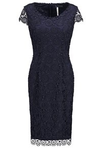 Robe bleu marine longueur genou avec motif en dentelle circulaire, manches courtes et ourlet festonné.