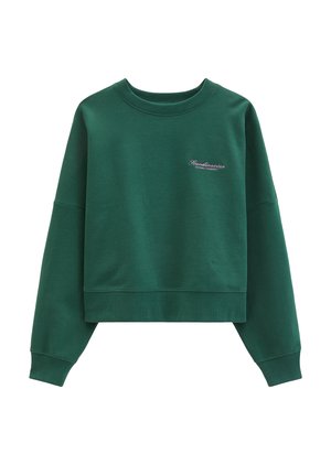 Sweat-shirt court vert foncé à manches longues avec un petit texte "Scandinavian Football Community" sur le côté gauche de la poitrine.