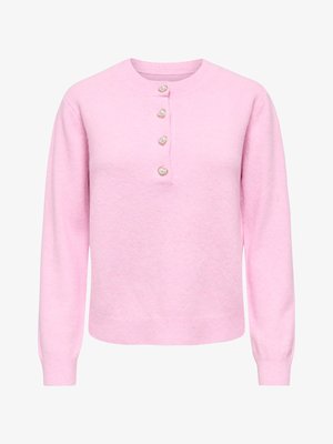 Mīksts rozā džemperis ar garām piedurknēm, apļveida kakla izgriezumu un četriem dekoratīviem sirds formas pērļu pogām priekšpusē.