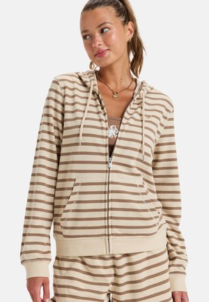 Beige zip-up hoodie with cream and brown horizontal stripes, featuring a hood, front pockets, and ribbed cuffs and hem.