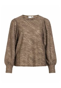 Blouse marron clair à manches longues avec texture ondulée et manches froncées. Encolure ronde, en tissu doux. Étiquette de la marque visible.