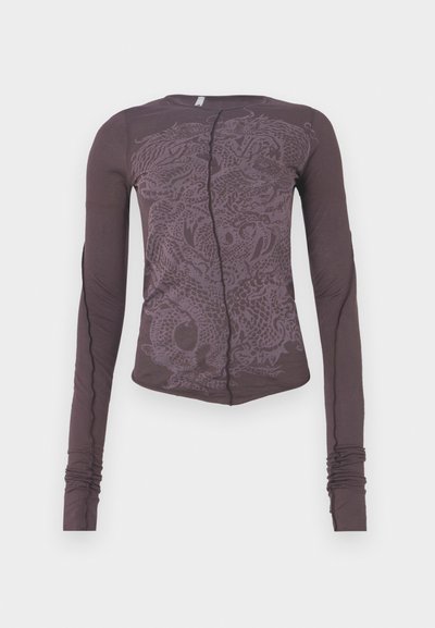 Long-sleeve top in dark purple fabric featuring a tonal dragon graphic, slim fit, round neckline, and gathered sleeve cuffs.