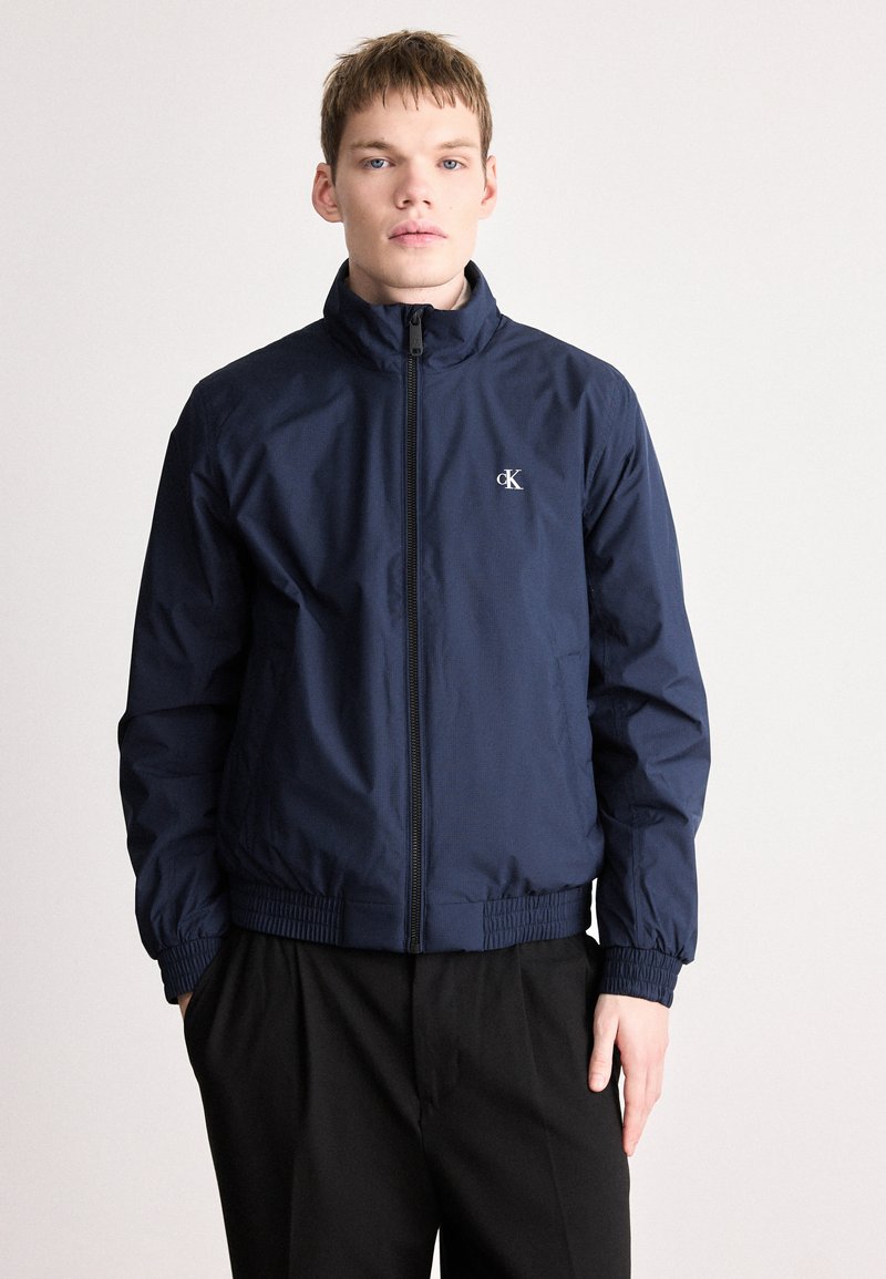 Calvin Klein Jeans PADDED HARRINGTON - Mezisezónní bunda - dark sapphire