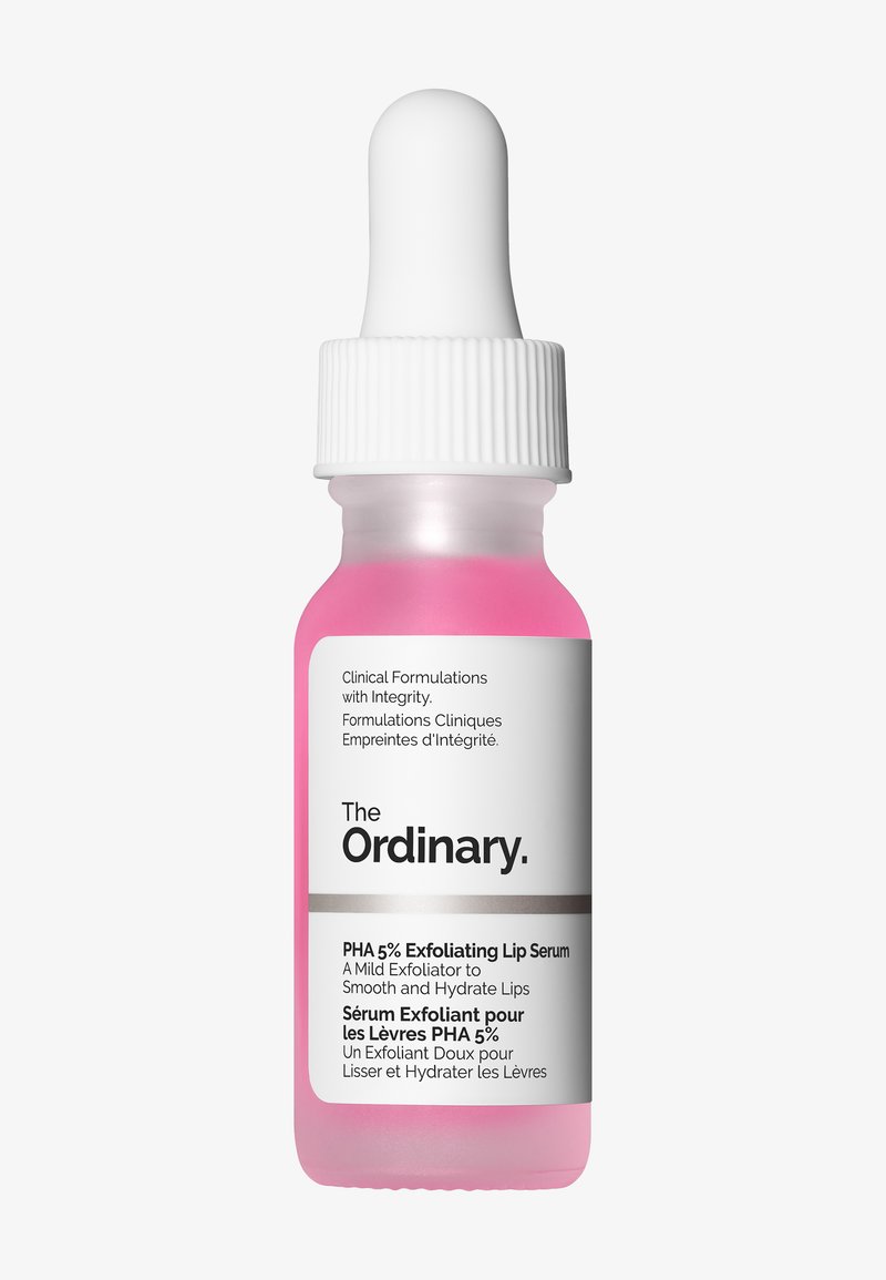 Bottiglia di vetro con liquido rosa, tappo contagocce bianco e un'etichetta bianca con testo nero. Nome del prodotto e descrizione in inglese e francese.