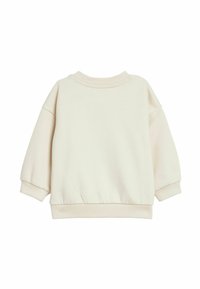 Crèmekleurige sweatshirt van zacht materiaal. Beschikt over een ronde hals, dropped shoulders en ribgebreide manchetten en zoom. Eenvoudig ontwerp zonder patronen.