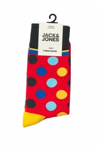 Calzini rossi in cotone con pois multicolori blu, neri e gialli, punta gialla e polsino nero. L'etichetta riporta "Jack & Jones."